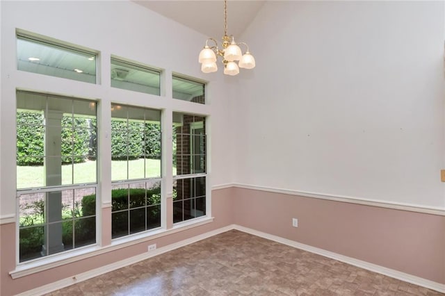 1056 Cross Gates Pl, Mobile, AL 36609 - empty room with a chandelier, vaulted ceiling, and tile patterned floors
