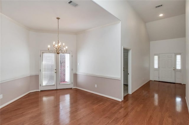 1056 Cross Gates Pl, Mobile, AL 36609 - entrance foyer with a chandelier, wood finished floors, crown molding, and a high ceiling