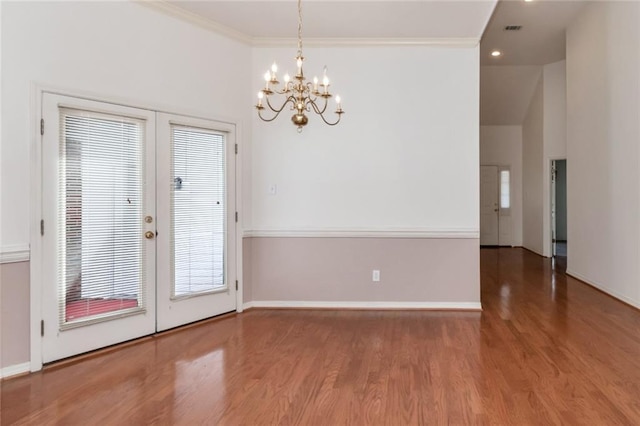 1056 Cross Gates Pl, Mobile, AL 36609 - unfurnished dining area with a chandelier, wood finished floors, french doors, crown molding, and plenty of natural light