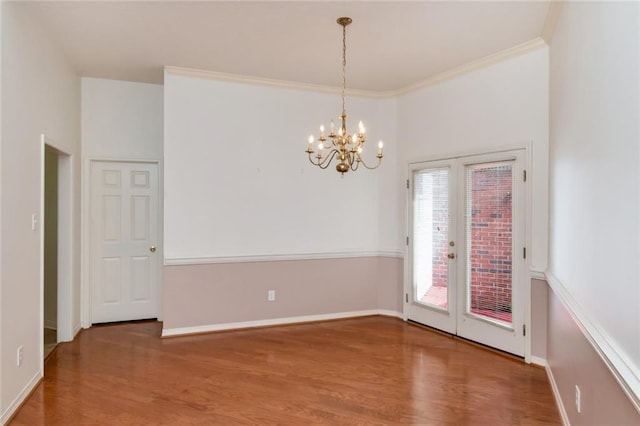 1056 Cross Gates Pl, Mobile, AL 36609 - unfurnished room featuring wood finished floors, french doors, a chandelier, and ornamental molding