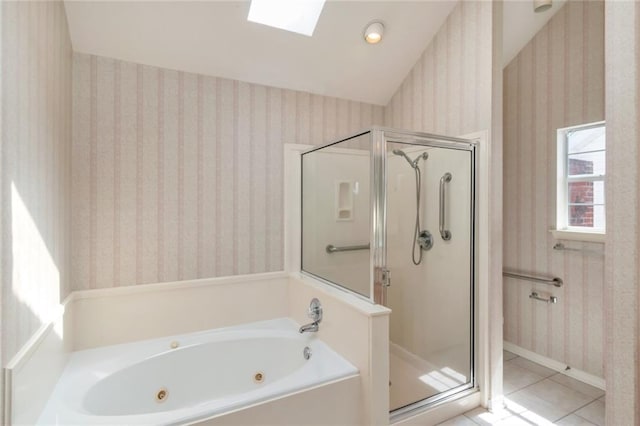 1056 Cross Gates Pl, Mobile, AL 36609 - full bath featuring a shower stall, wallpapered walls, a jetted tub, tile patterned floors, and a skylight