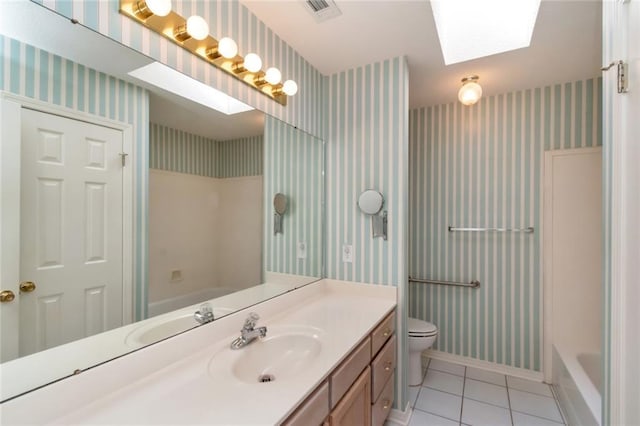 1056 Cross Gates Pl, Mobile, AL 36609 - bathroom featuring wallpapered walls, vanity, tile patterned floors, and a skylight