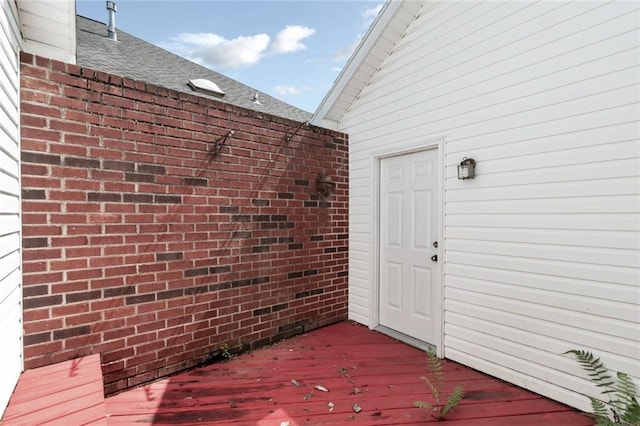 1056 Cross Gates Pl, Mobile, AL 36609 - entrance to property with brick siding, a shingled roof, and a deck
