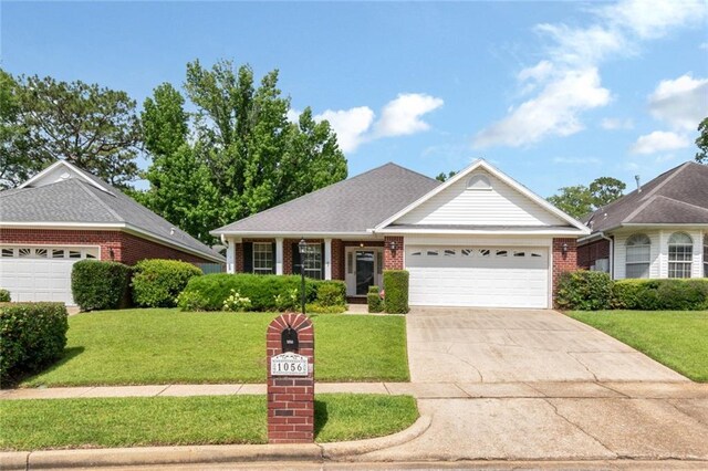 1056 Cross Gates Pl, Mobile, AL 36609 - ranch-style home featuring brick siding, a garage, driveway, and a front yard