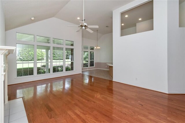 1056 Cross Gates Pl, Mobile, AL 36609 - unfurnished living room with high vaulted ceiling, a ceiling fan, plenty of natural light, wood finished floors, and recessed lighting
