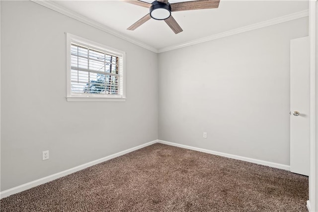 empty room featuring a ceiling fan, baseboards, ornamental molding, and carpet flooring