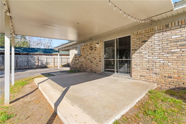 view of patio featuring fence