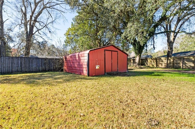 view of shed with a fenced backyard