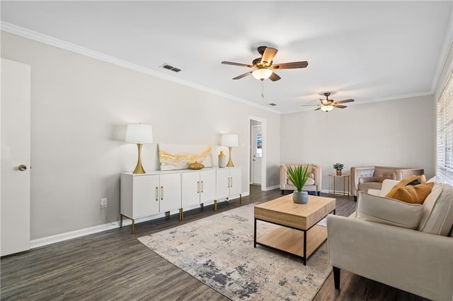 living room featuring ornamental molding, visible vents, dark wood finished floors, and baseboards