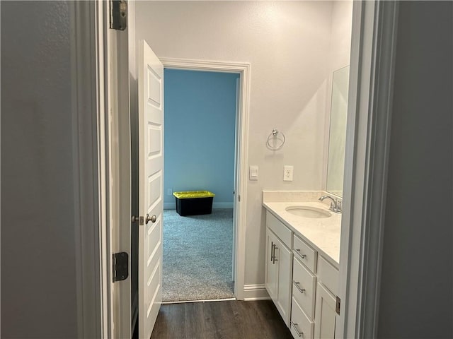 bathroom featuring hardwood / wood-style flooring and vanity