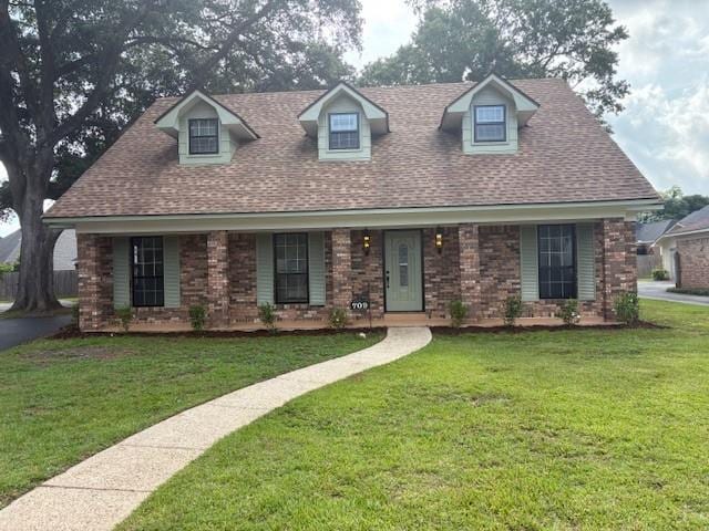 709 Oak Field Dr, Mobile, AL 36609 - cape cod house with a front lawn and a shingled roof