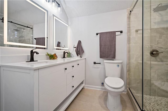 709 Oak Field Dr, Mobile, AL 36609 - full bathroom featuring toilet, double vanity, a shower stall, baseboards, and tile patterned floors