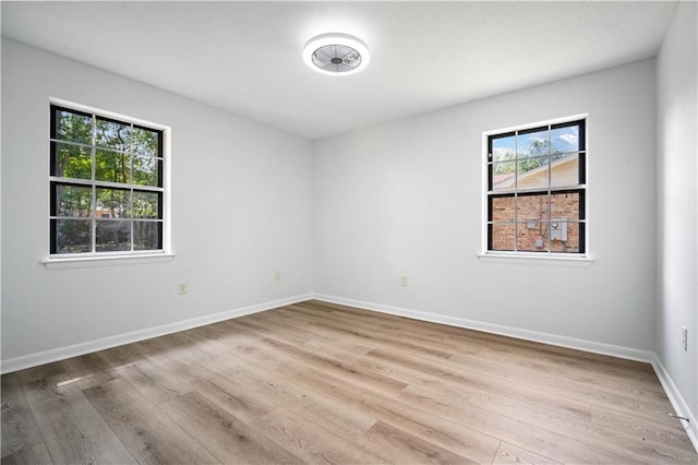 709 Oak Field Dr, Mobile, AL 36609 - unfurnished room featuring plenty of natural light, wood finished floors, and baseboards