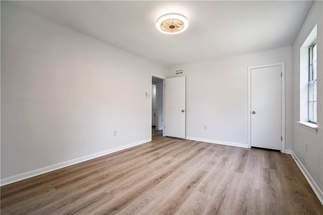 709 Oak Field Dr, Mobile, AL 36609 - unfurnished bedroom featuring wood finished floors and baseboards