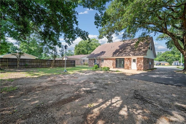 709 Oak Field Dr, Mobile, AL 36609 - rear view of house with brick siding