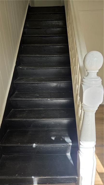 stairway with wood-type flooring