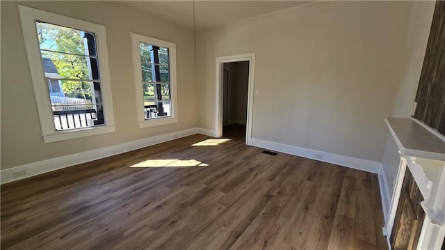 spare room featuring dark hardwood / wood-style floors