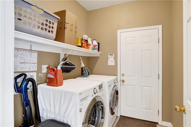 laundry area with carpet floors, laundry area, and washer and clothes dryer