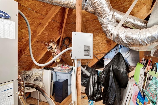 unfinished attic featuring a heating unit