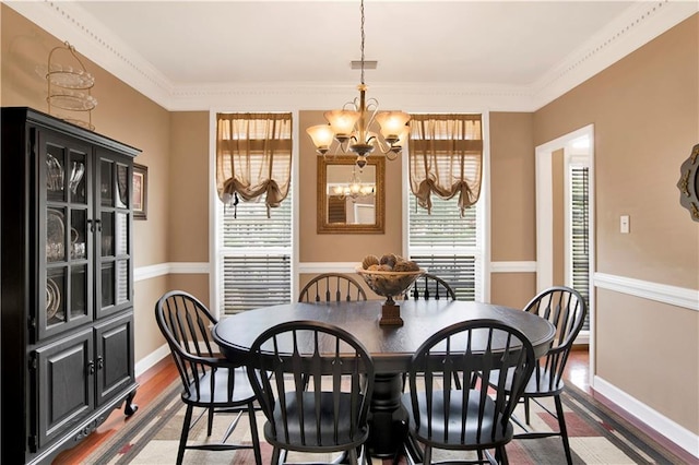 dining room featuring baseboards, visible vents, dark wood-type flooring, and a chandelier