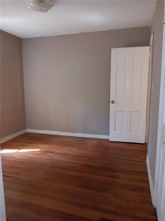 1863 Mott Dr N, Mobile, AL 36617 - spare room featuring wood finished floors, baseboards, and a textured ceiling
