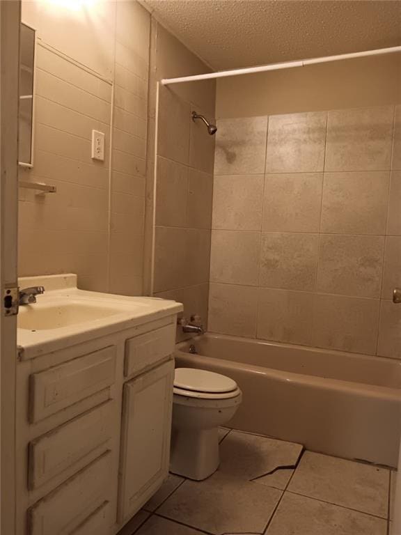 1863 Mott Dr N, Mobile, AL 36617 - full bath with tile patterned flooring, toilet, bathing tub / shower combination, vanity, and a textured ceiling