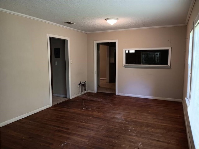 1863 Mott Dr N, Mobile, AL 36617 - unfurnished room with wood finished floors, ornamental molding, a textured ceiling, and baseboards