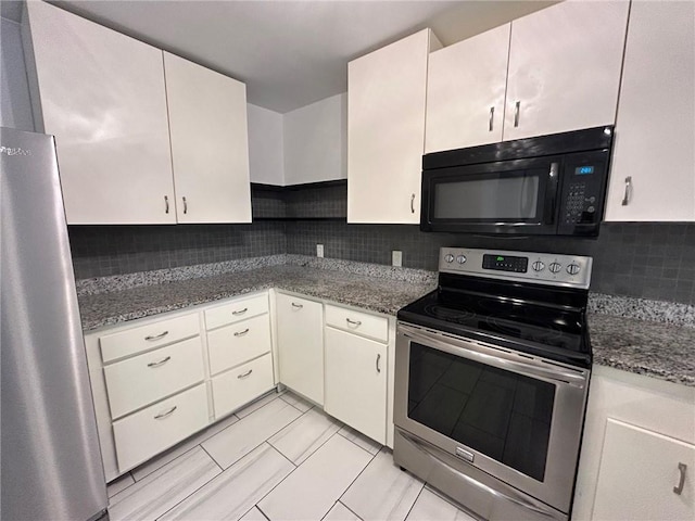 kitchen featuring decorative backsplash, stainless steel appliances, and dark stone counters