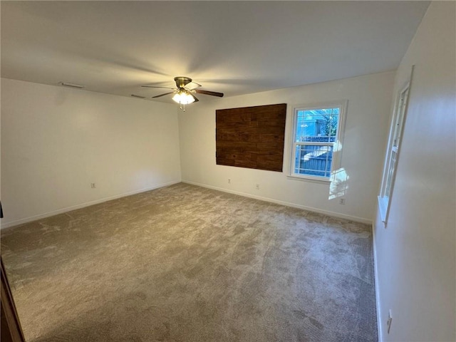 unfurnished room with light carpet and ceiling fan