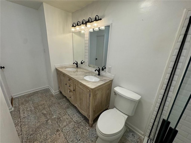 bathroom with vanity, toilet, and walk in shower