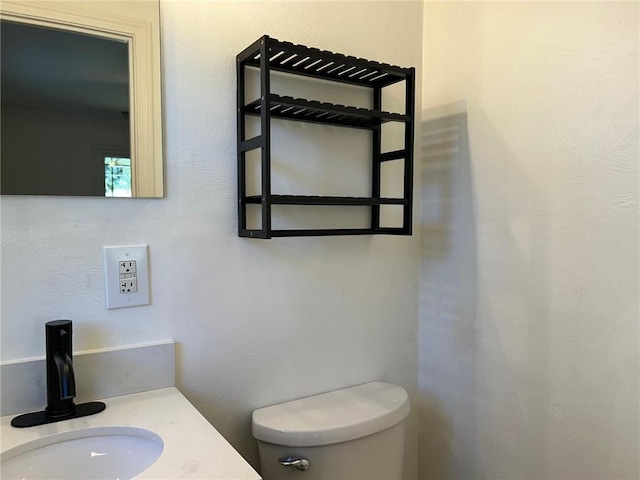 bathroom with toilet and sink