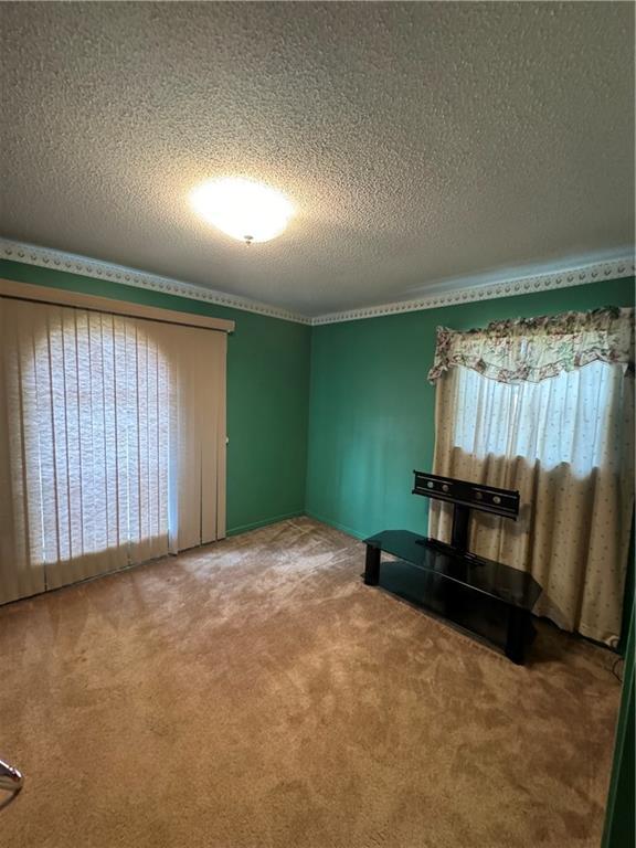 interior space featuring a textured ceiling