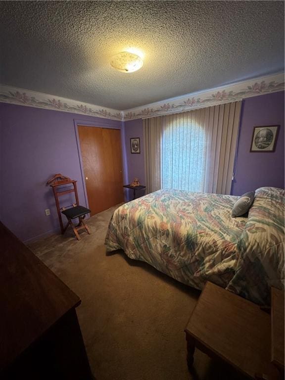 carpeted bedroom with a textured ceiling