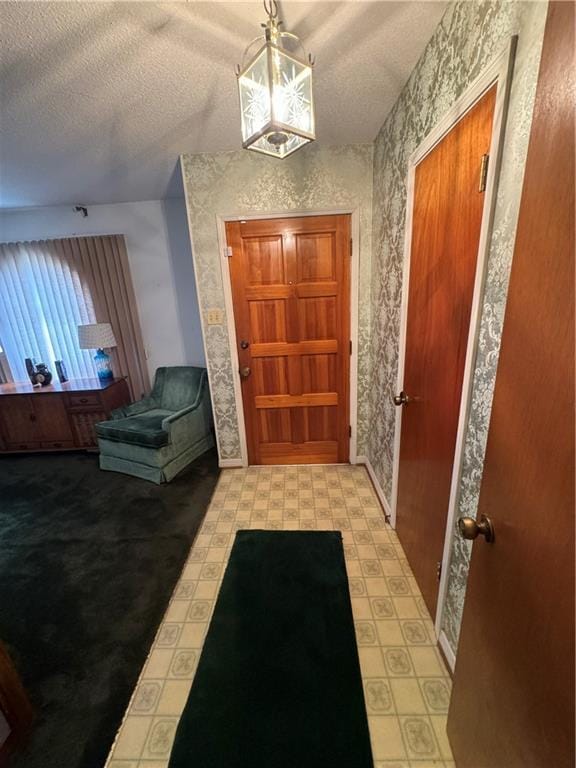 foyer featuring a textured ceiling