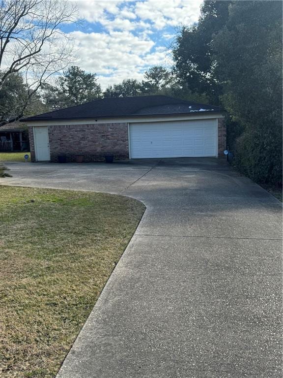 garage with a lawn