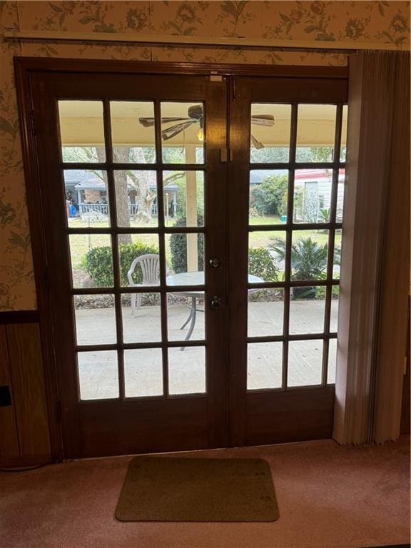 doorway with french doors, carpet, and a wealth of natural light