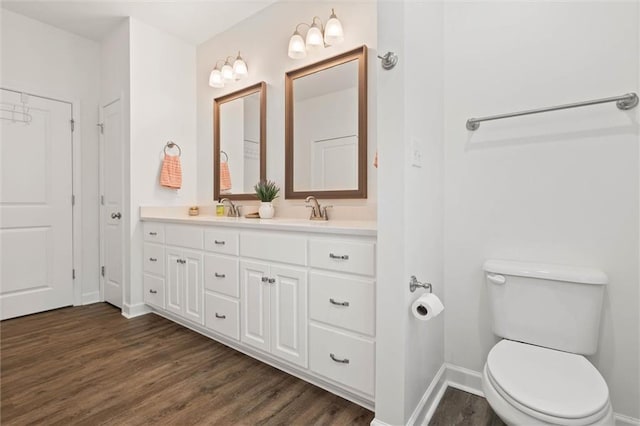 911 Lockenbie Pl, Dauphin Island, AL 36528 - bathroom with double vanity and wood finished floors