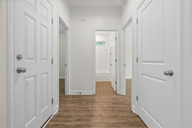 911 Lockenbie Pl, Dauphin Island, AL 36528 - corridor featuring dark wood-style flooring and baseboards