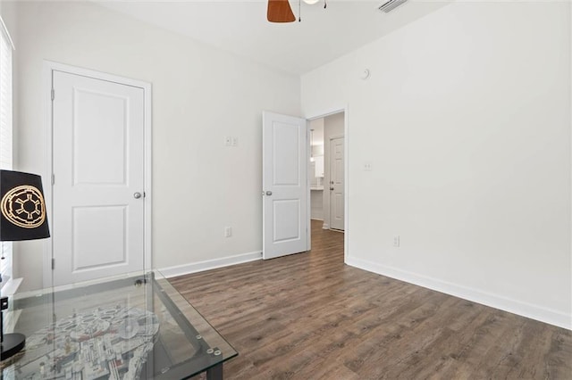 911 Lockenbie Pl, Dauphin Island, AL 36528 - unfurnished bedroom with wood finished floors and ceiling fan