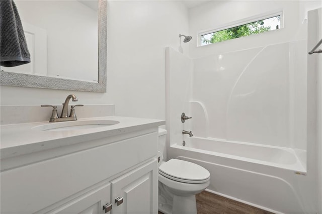911 Lockenbie Pl, Dauphin Island, AL 36528 - bathroom featuring vanity, shower / washtub combination, and wood finished floors