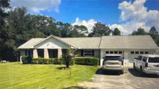 10398 Route Rd, Lillian, AL 36549 - ranch-style home featuring an attached garage, concrete driveway, and a front yard