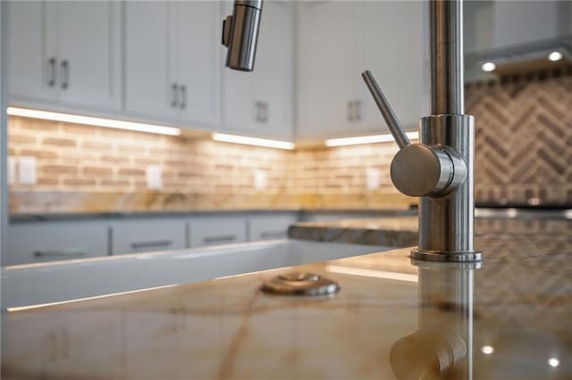 room details with white cabinets and light countertops