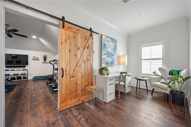 workout area with baseboards, dark wood finished floors, ceiling fan, a baseboard heating unit, and a barn door