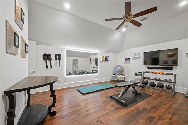 workout area featuring vaulted ceiling, wood finished floors, visible vents, and ceiling fan