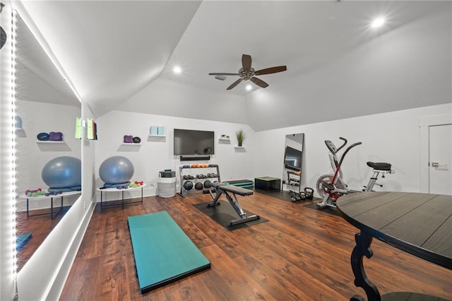 workout area featuring baseboards, wood finished floors, a ceiling fan, and vaulted ceiling