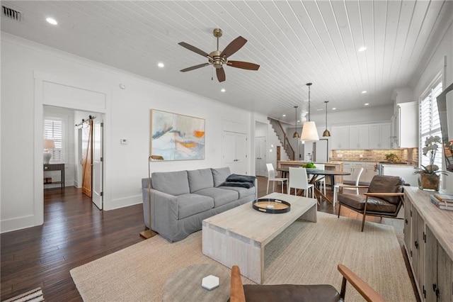 living area featuring dark wood-type flooring, recessed lighting, stairway, wooden ceiling, and ceiling fan