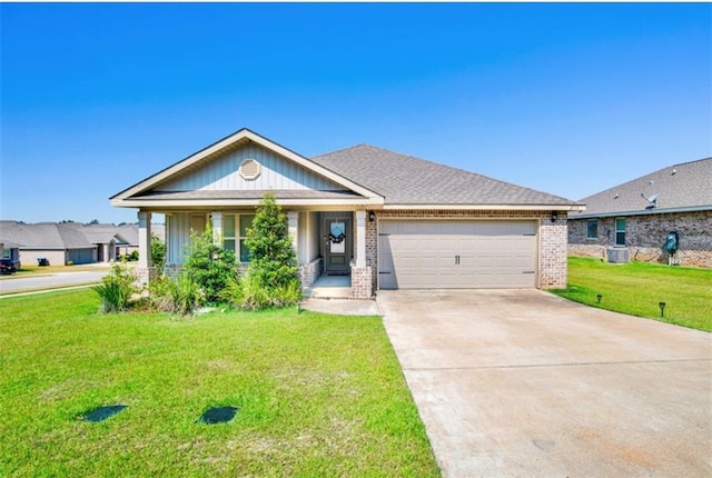 view of front facade featuring a garage, a shingled roof, concrete driveway, a front lawn, and brick siding