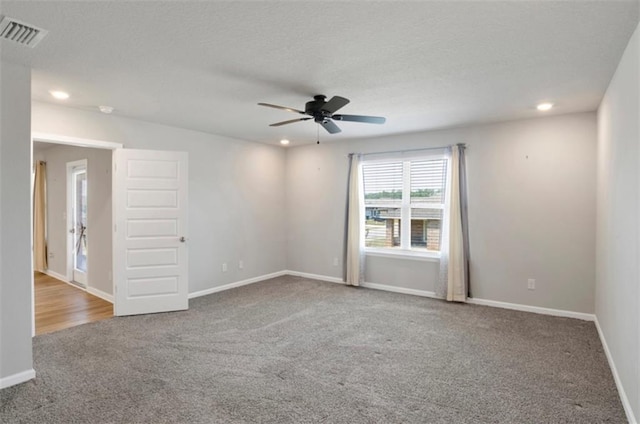 spare room featuring baseboards, visible vents, a ceiling fan, carpet floors, and recessed lighting