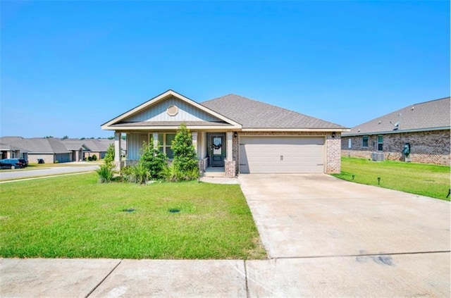 view of front facade with brick siding, concrete driveway, a garage, a residential view, and a front lawn