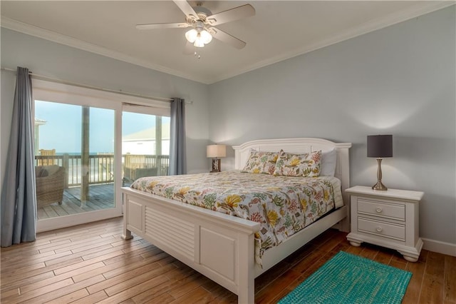 bedroom featuring dark wood-style flooring, a ceiling fan, baseboards, access to outside, and crown molding